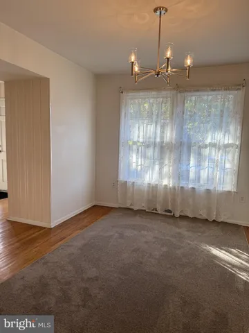 a view of a room with large windows