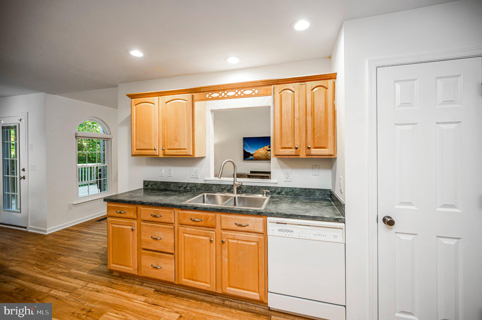 211 Battlefield Road Locust Grove, VA 22508 - Photo 15 of 57 Kitchen sink area with view into the living room