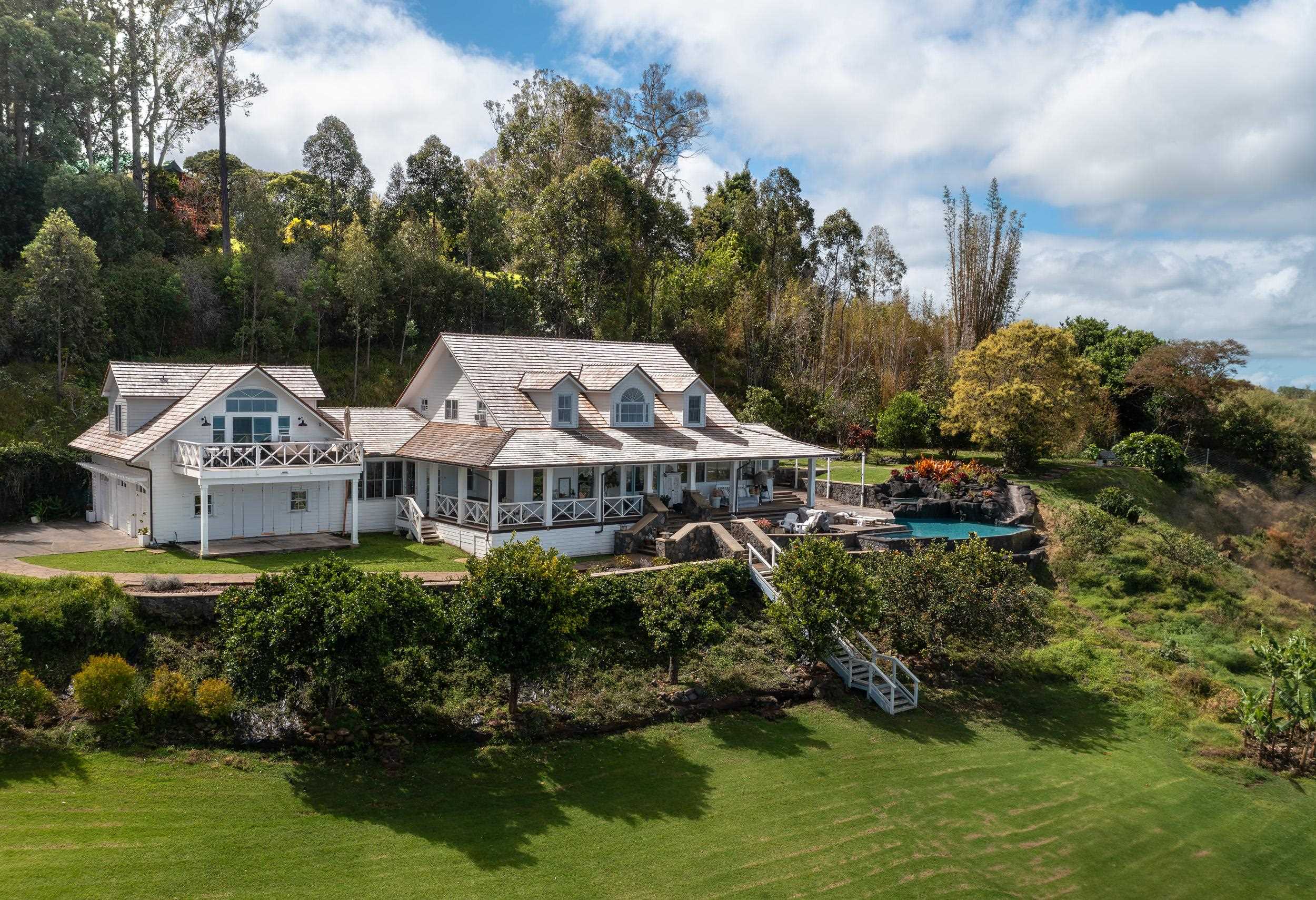 1630 Olinda Road Makawao, HI 96768 - Photo 1 of 50 a aerial view of a house with a yard plants and large trees