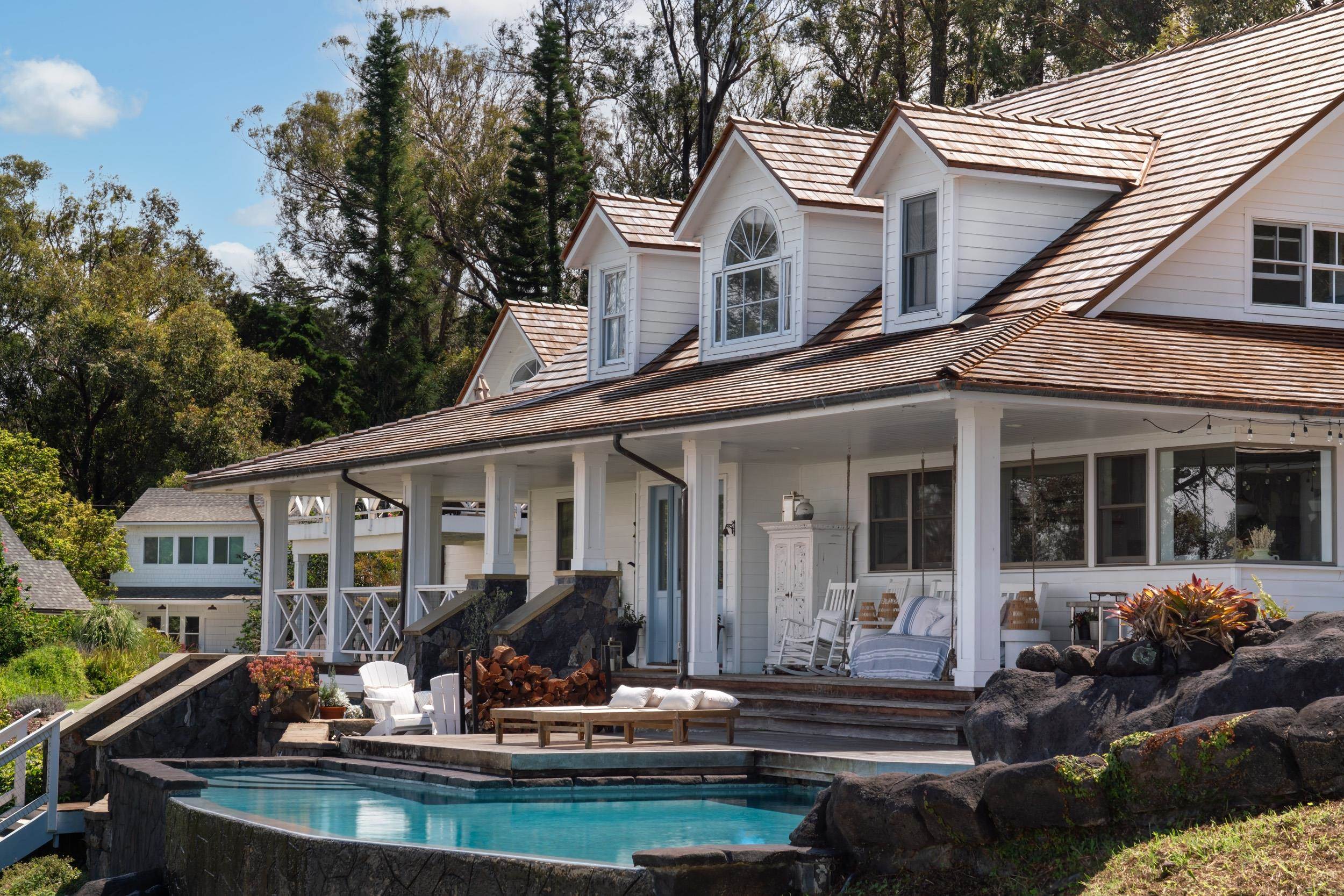 1630 Olinda Road Makawao, HI 96768 - Photo 2 of 50 a front view of a house with a garden and patio