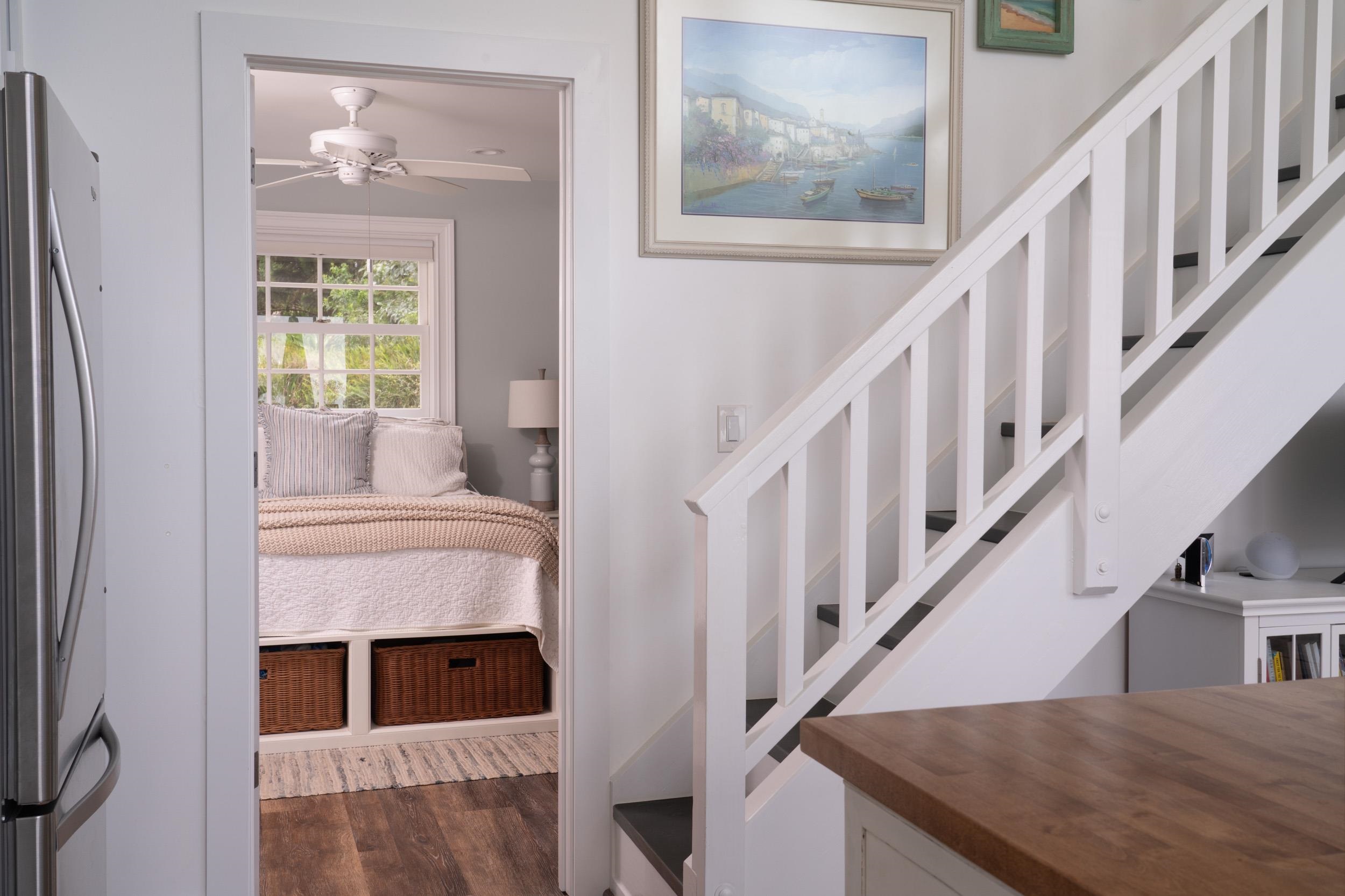 1630 Olinda Road Makawao, HI 96768 - Photo 44 of 50 a living room with stairs and a fireplace