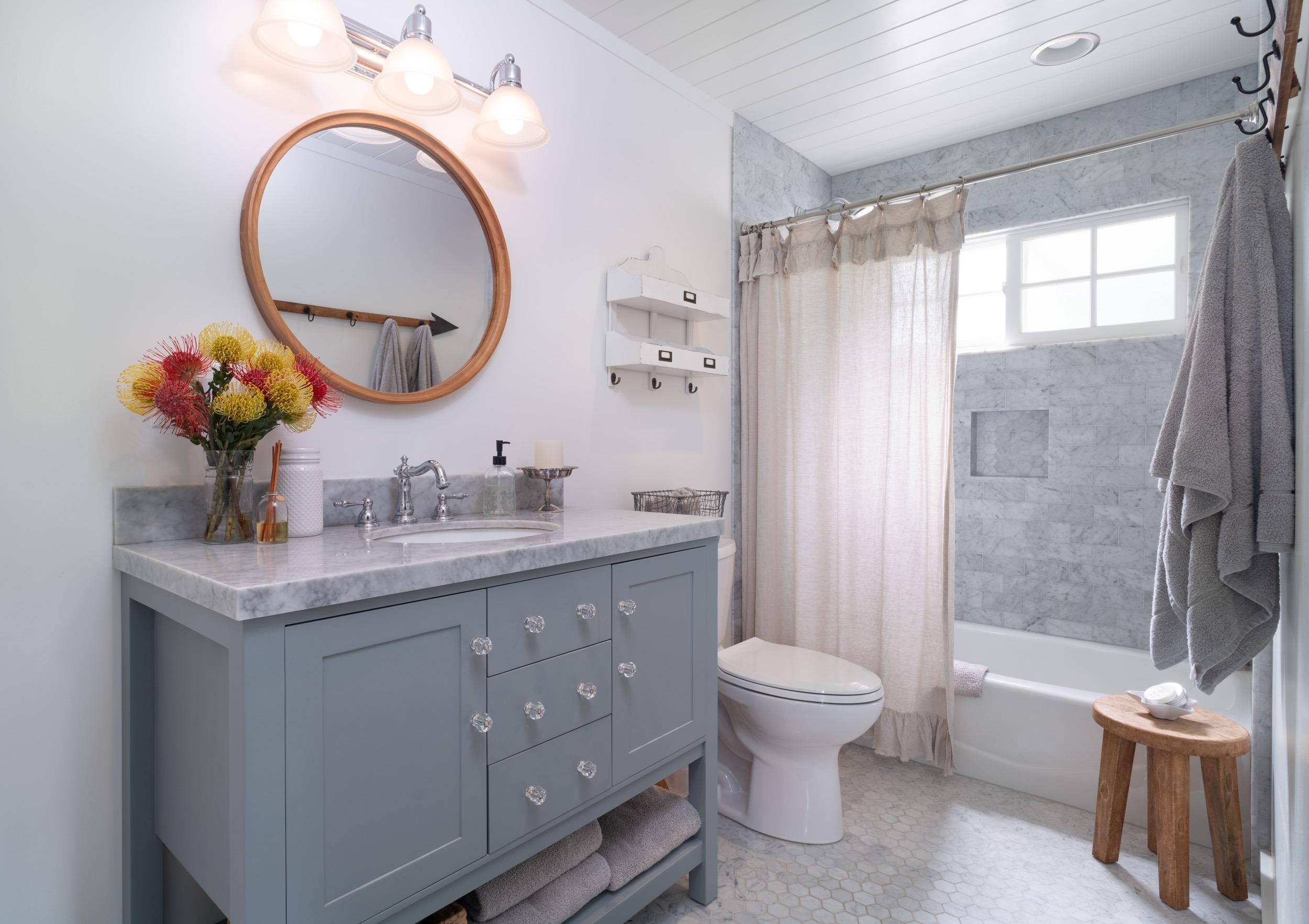1630 Olinda Road Makawao, HI 96768 - Photo 46 of 50 a bathroom with a granite countertop toilet a sink and a mirror
