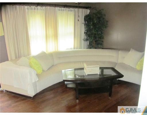 60 Glenville Road Edison, NJ 08817 - Photo 4 of 8 a living room with furniture and a window
