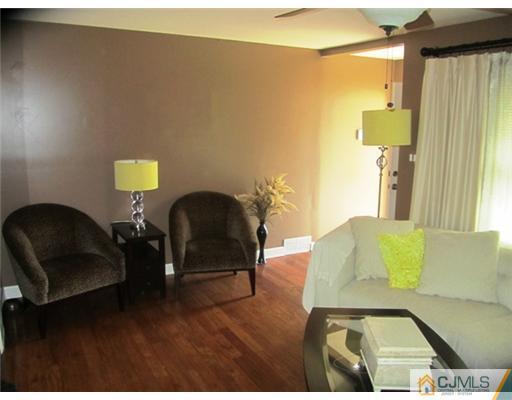 60 Glenville Road Edison, NJ 08817 - Photo 5 of 8 a living room with furniture and a mirror