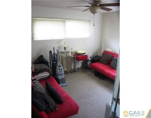 60 Glenville Road Edison, NJ 08817 - Photo 8 of 8 a living room with furniture and a window