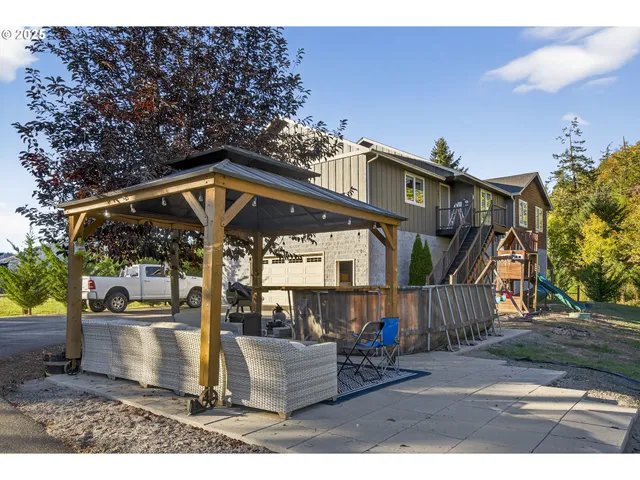 a view of a house with a wooden deck