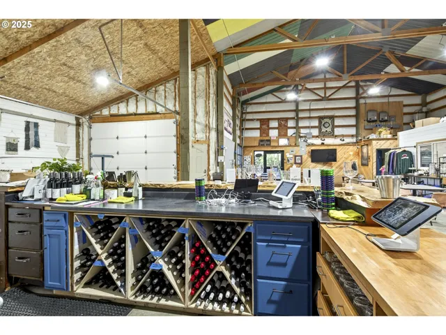 a kitchen with stainless steel appliances granite countertop a sink and wooden cabinets
