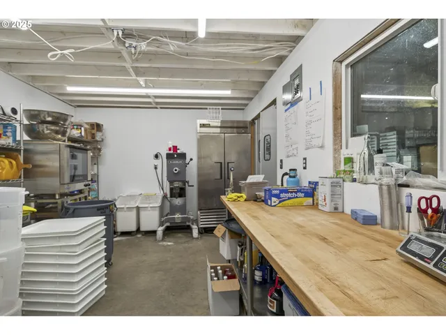 a room with gym equipment and a view of living room
