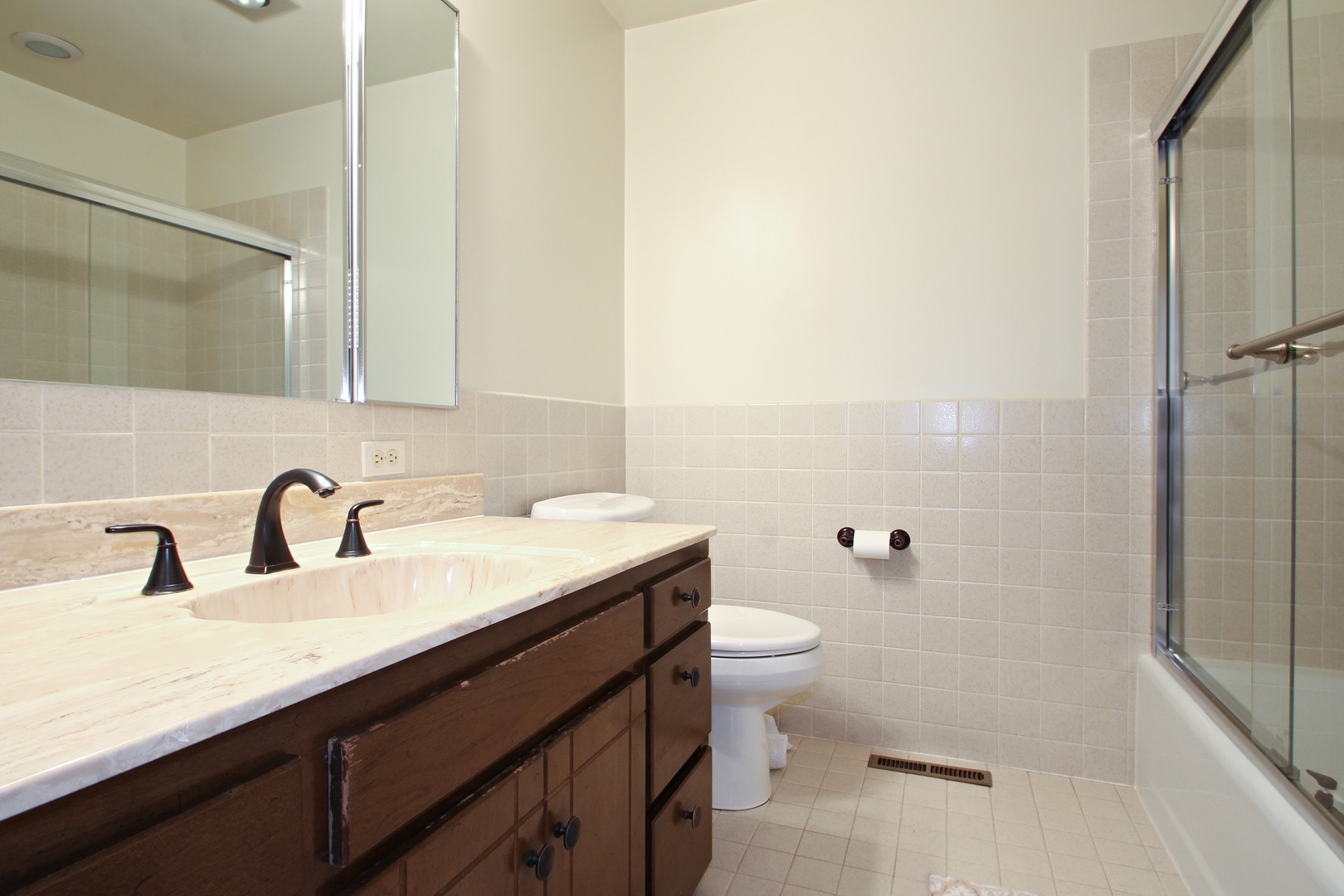 77 Brandon Road Northfield, IL 60093 - Photo 13 of 18 a bathroom with a granite countertop sink a toilet and a mirror