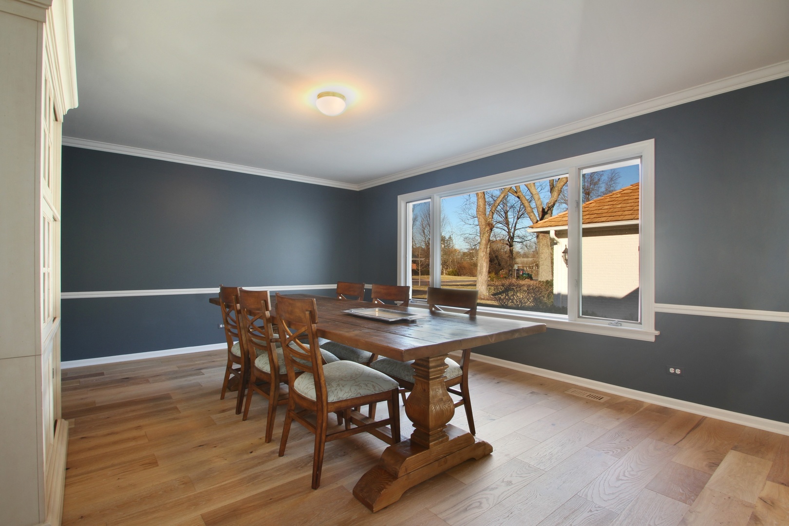77 Brandon Road Northfield, IL 60093 - Photo 7 of 18 a view of a dining room with furniture window and outside view