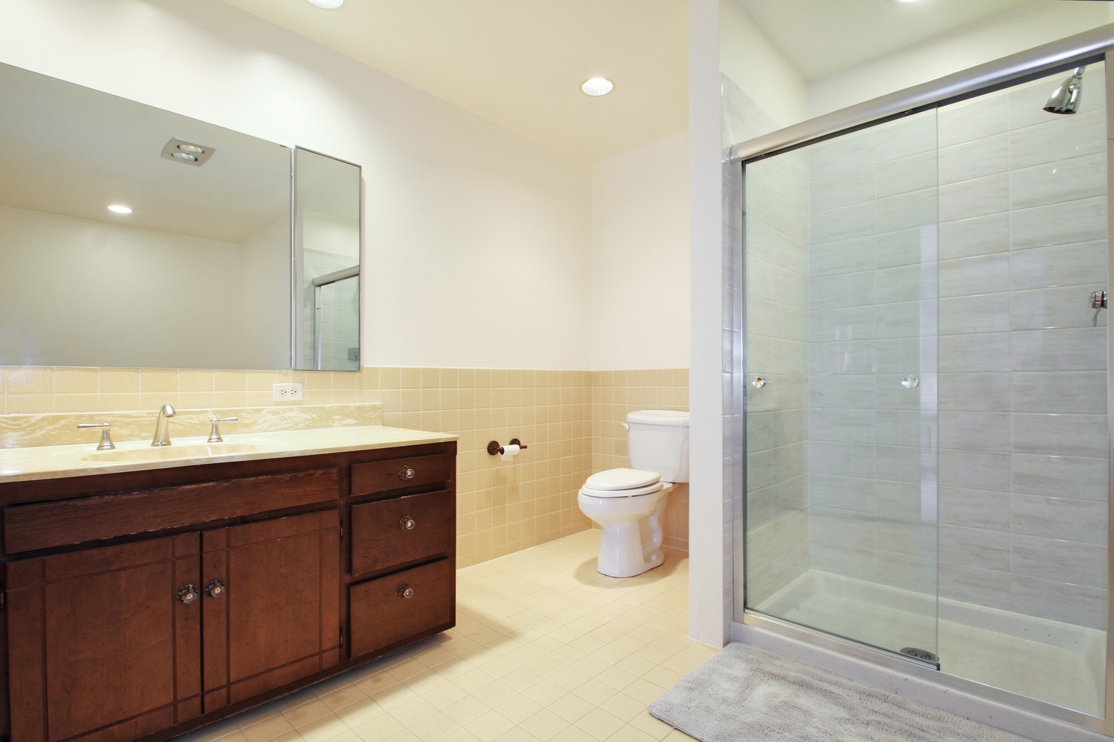 77 Brandon Road Northfield, IL 60093 - Photo 10 of 18 a bathroom with a sink and a mirror