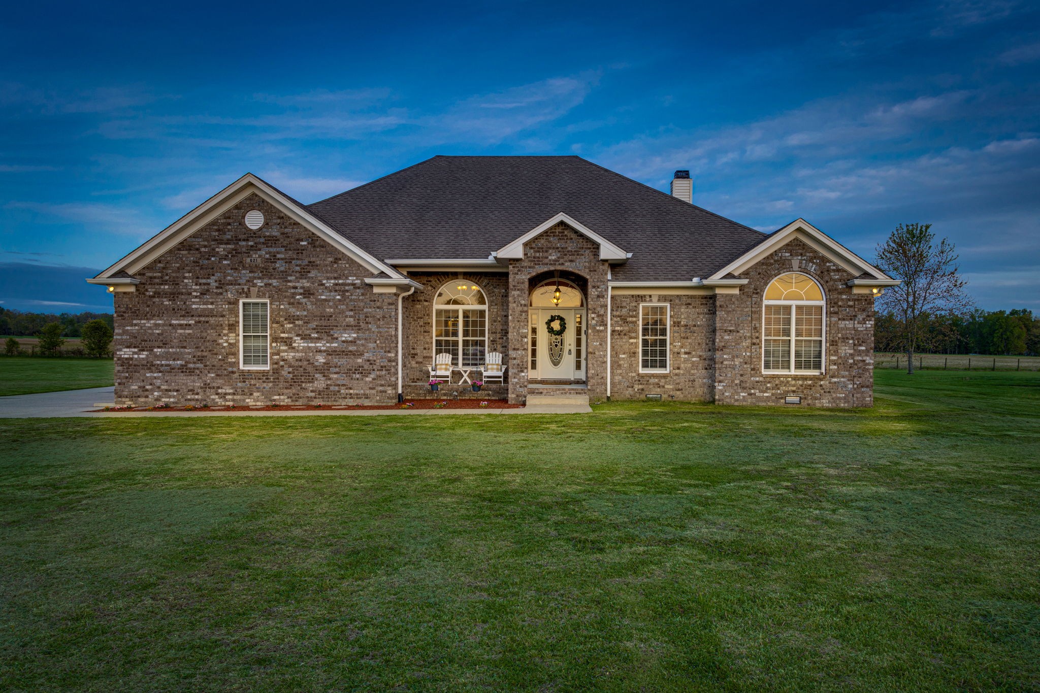 621 Jackson Road Portland, TN 37148 - Photo 1 of 32 a front view of a house with a garden