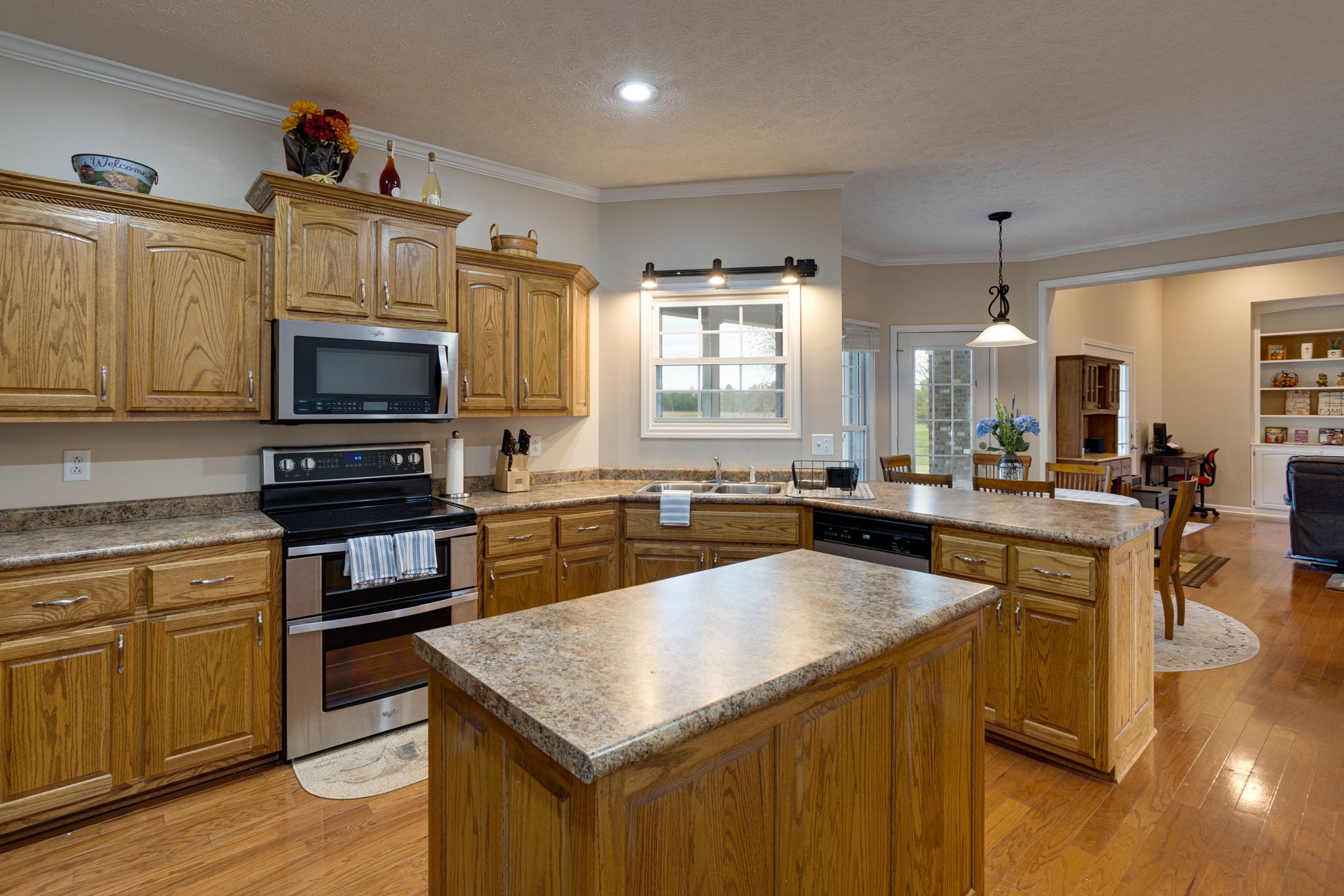 621 Jackson Road Portland, TN 37148 - Photo 11 of 32 a kitchen with a stove a sink and a microwave