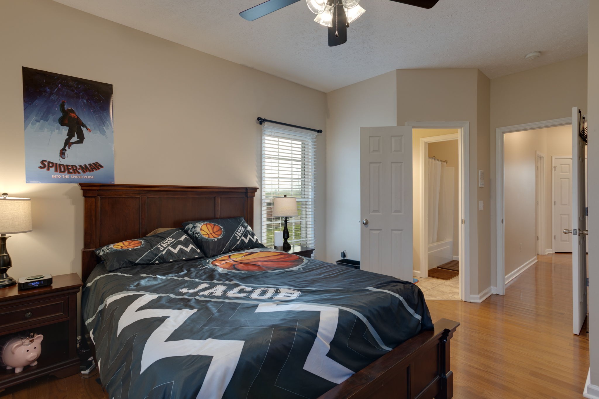 621 Jackson Road Portland, TN 37148 - Photo 12 of 32 a bedroom with a bed and a chandelier