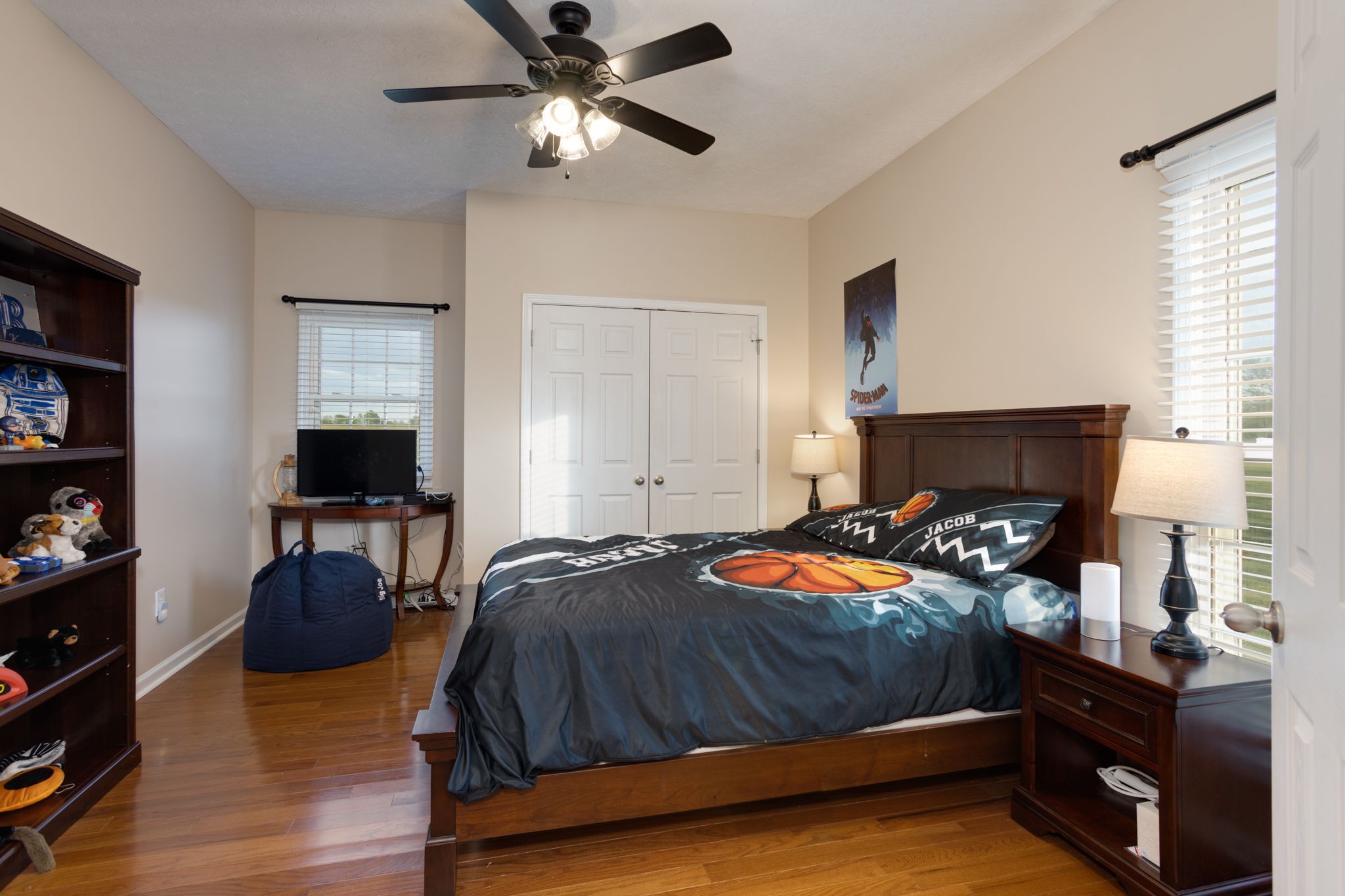 621 Jackson Road Portland, TN 37148 - Photo 13 of 32 a bedroom with a bed and a chandelier