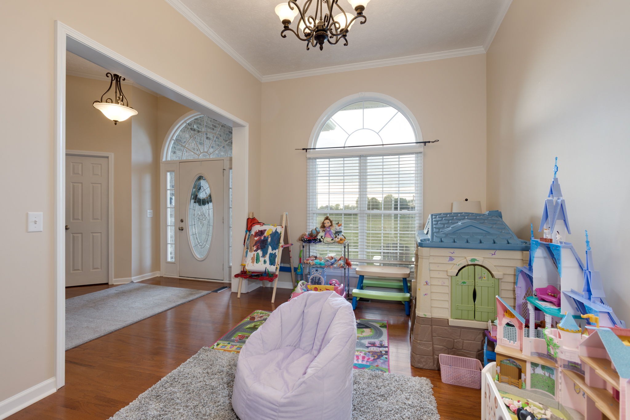 621 Jackson Road Portland, TN 37148 - Photo 18 of 32 a living room with fireplace furniture and a chandelier