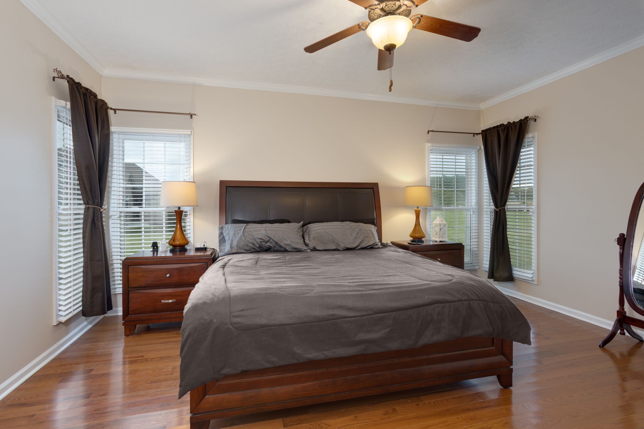 621 Jackson Road Portland, TN 37148 - Photo 22 of 32 a bedroom with a bed and a chandelier