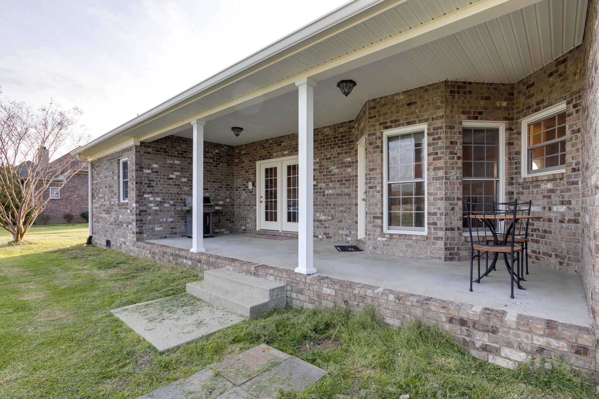 621 Jackson Road Portland, TN 37148 - Photo 28 of 32 a view of a patio with table and chairs and wooden fence