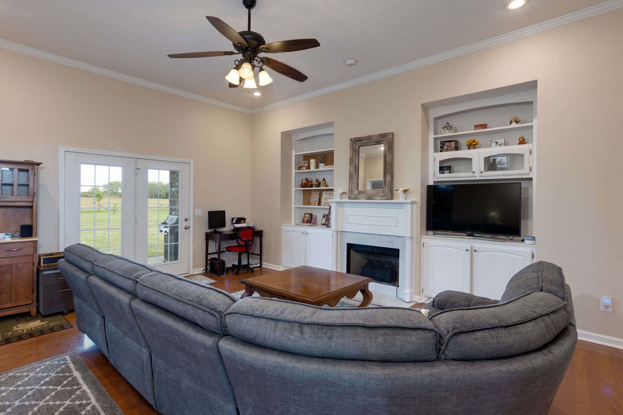 621 Jackson Road Portland, TN 37148 - Photo 6 of 32 a living room with furniture flat screen tv and a fireplace