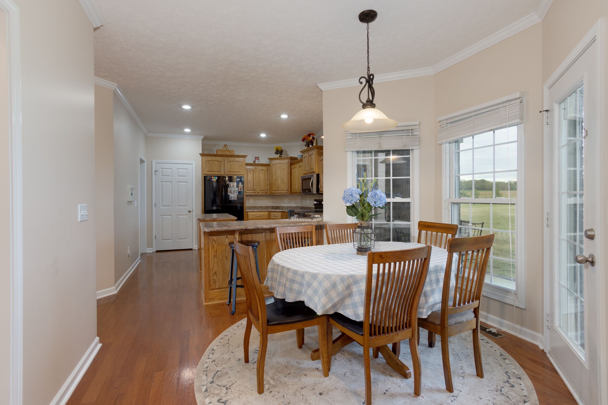 621 Jackson Road Portland, TN 37148 - Photo 9 of 32 a dining room with furniture window and wooden floor