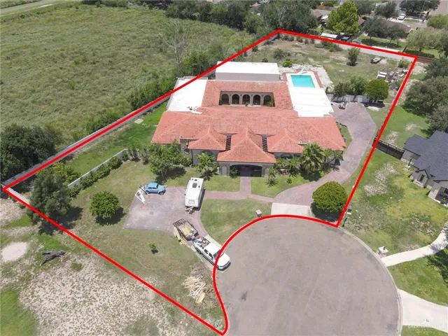 an aerial view of a house with a lake view