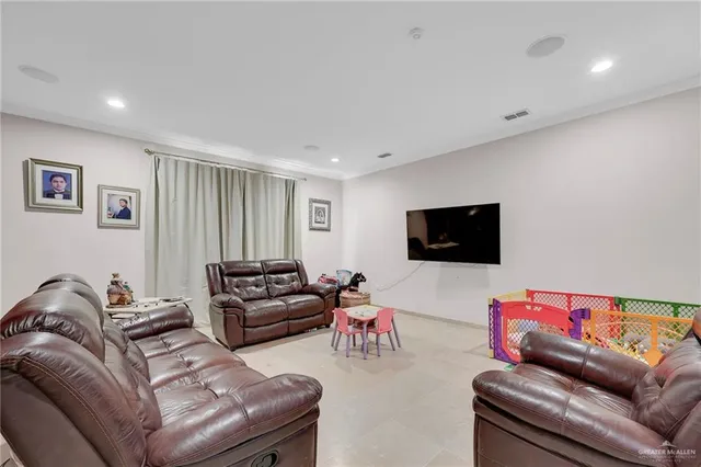 a kitchen with stainless steel appliances kitchen island a chandelier