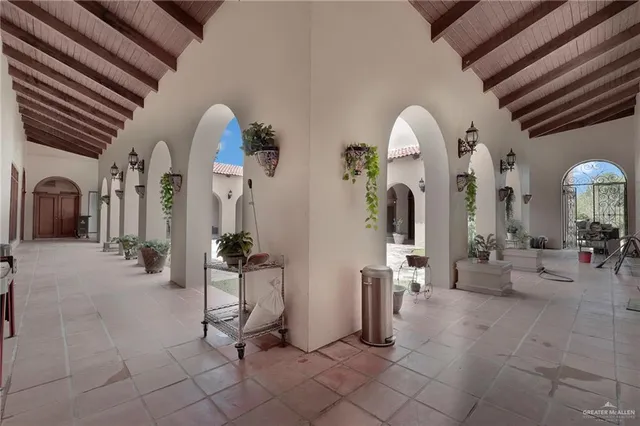 a view of a house with backyard and a yard