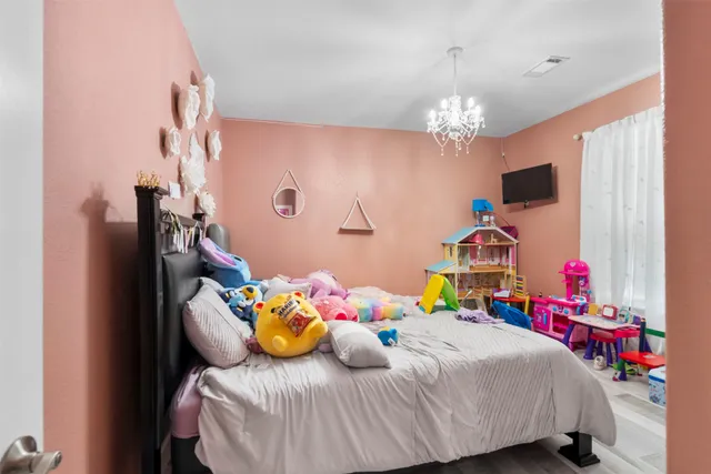 a living room with furniture and flowers