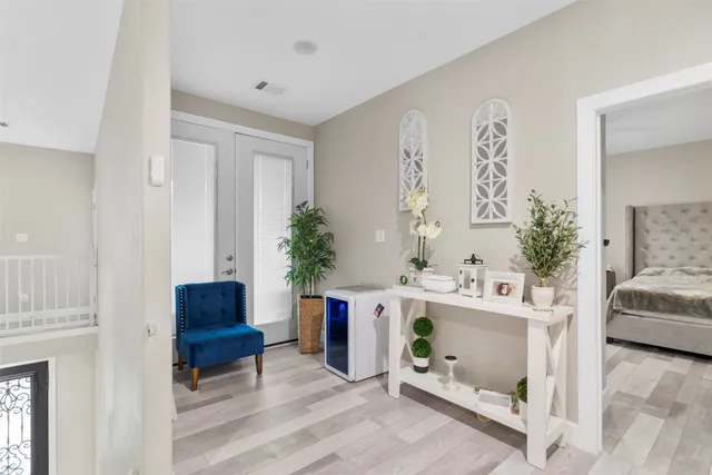 a living room with furniture and flowers