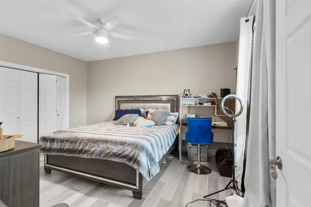 a balcony with wooden floor and outdoor seating