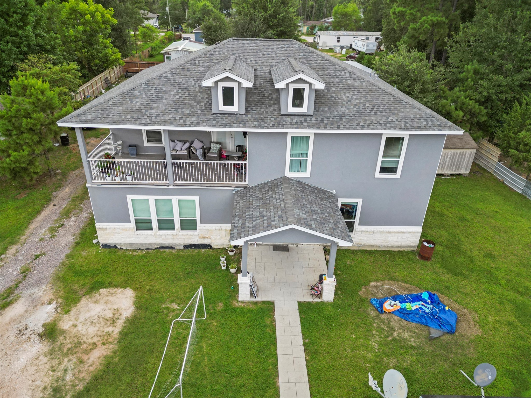 21502 Flint Trail Porter, TX 77365 - Photo 25 of 38 a aerial view of a house with a yard table and chairs