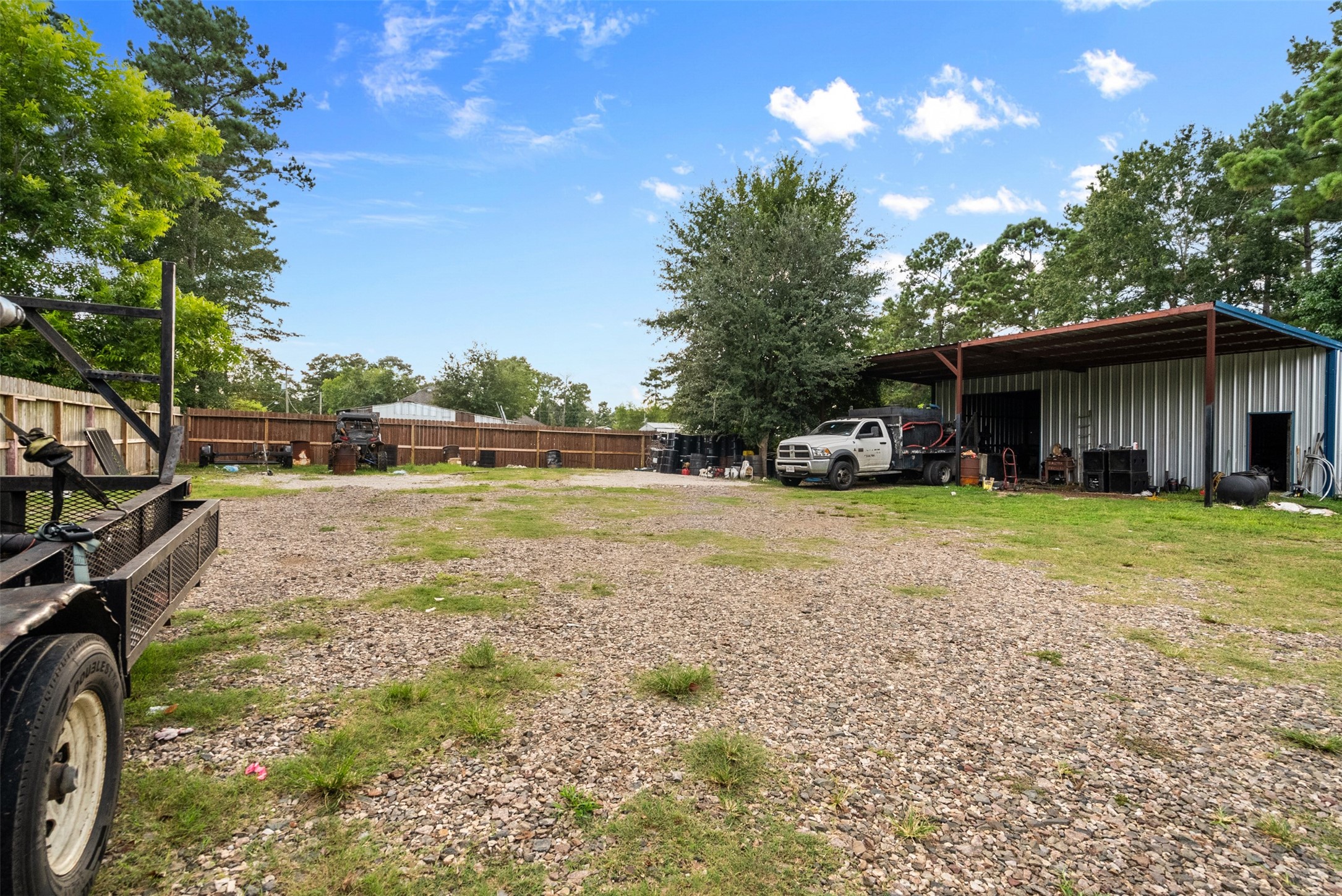 21502 Flint Trail Porter, TX 77365 - Photo 26 of 38 a view of a house with backyard and sitting area