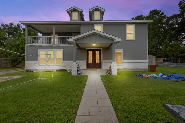 a front view of a house with garden