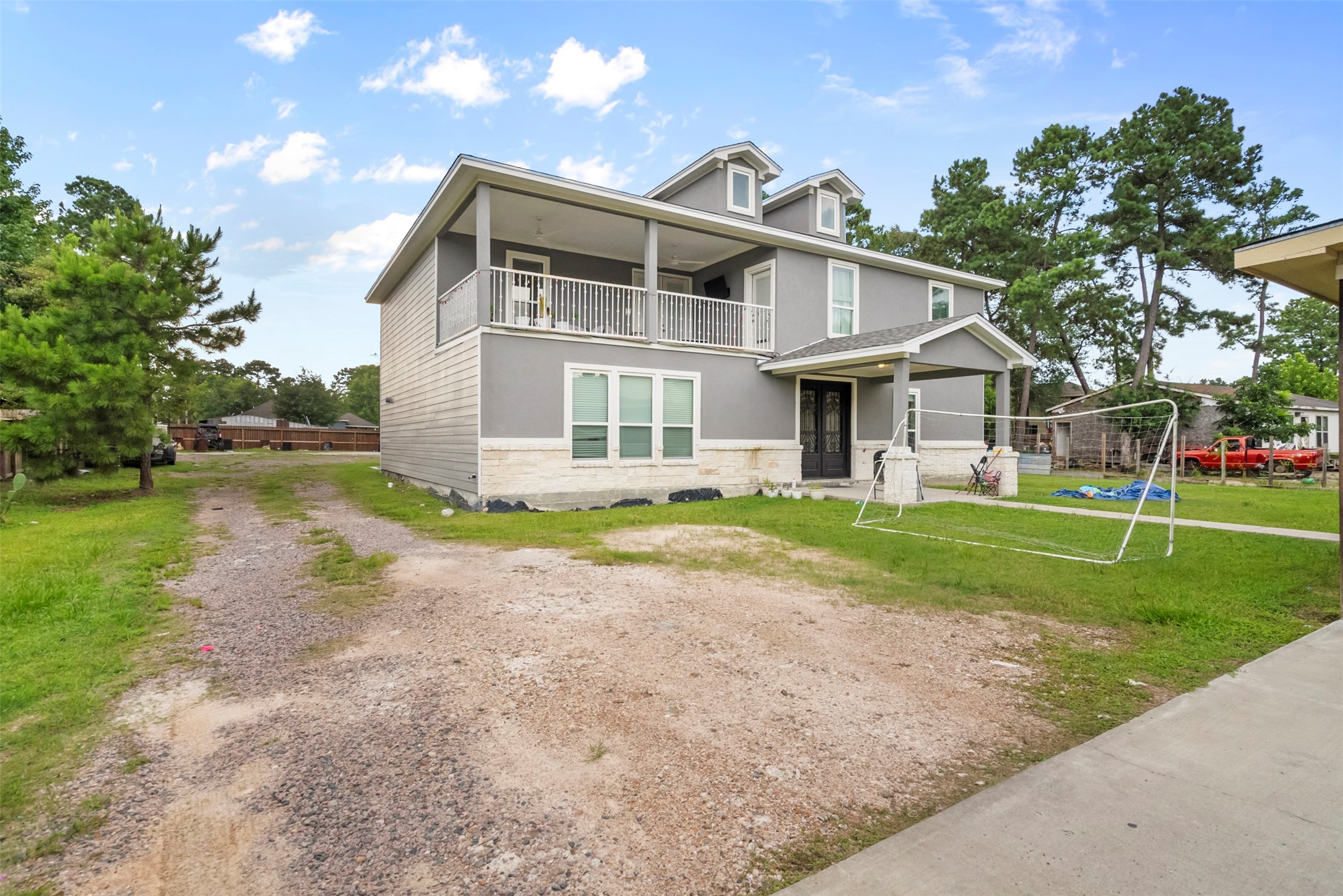 21502 Flint Trail Porter, TX 77365 - Photo 30 of 38 a front view of a house with a yard and lake view
