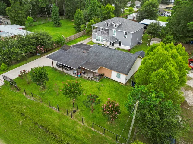 an aerial view of a house with a garden