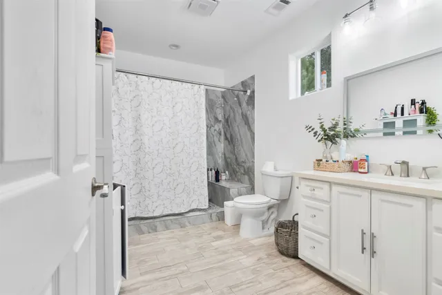a view of a dining room with furniture and a livingroom