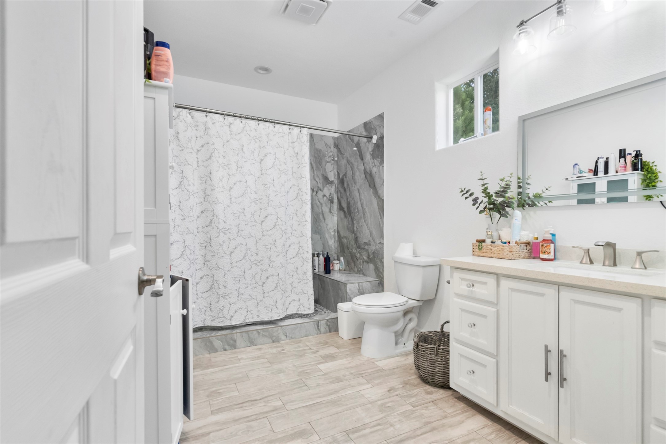 21502 Flint Trail Porter, TX 77365 - Photo 5 of 38 a bathroom with a sink toilet and shower