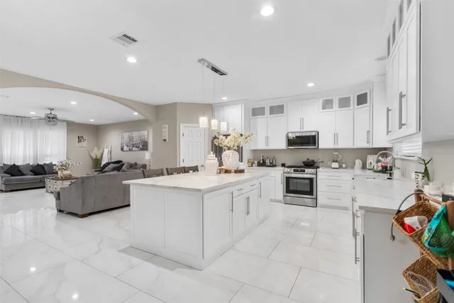 a view of kitchen with sink and living room