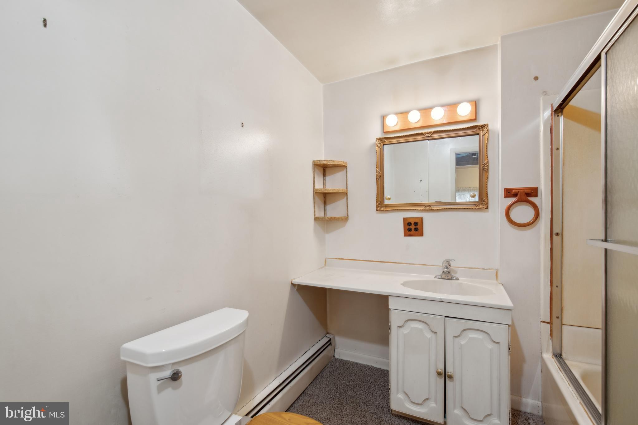 1600 Oriole Road Edgewater, MD 21037 - Photo 37 of 41 a bathroom with a toilet sink and mirror
