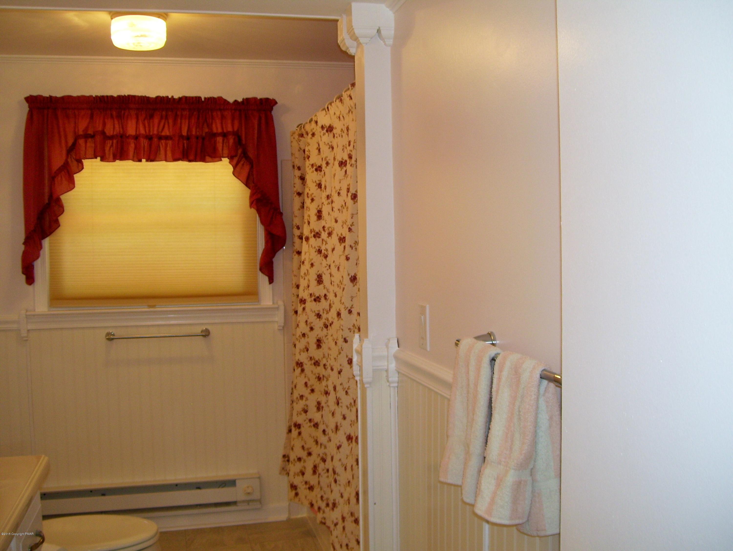 2610 Brookdale Road Scotrun, PA 18355 - Photo 11 of 37 a bathroom with a sink and a mirror