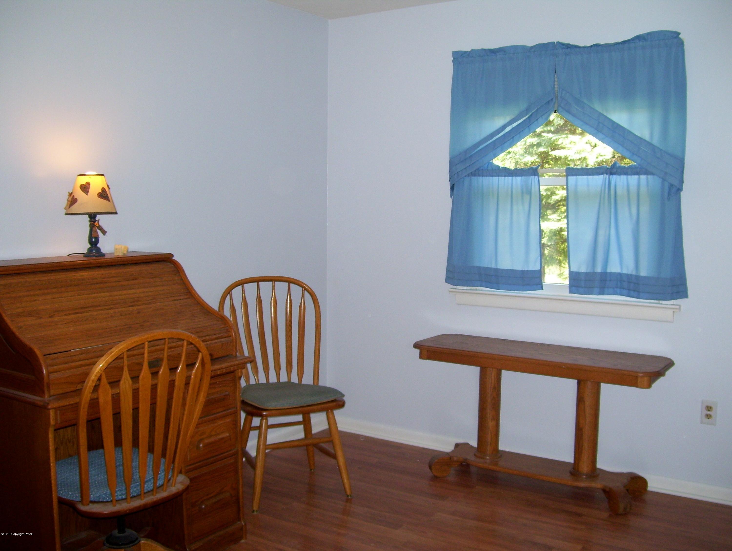2610 Brookdale Road Scotrun, PA 18355 - Photo 13 of 37 a view of a bedroom with furniture window and wooden floor