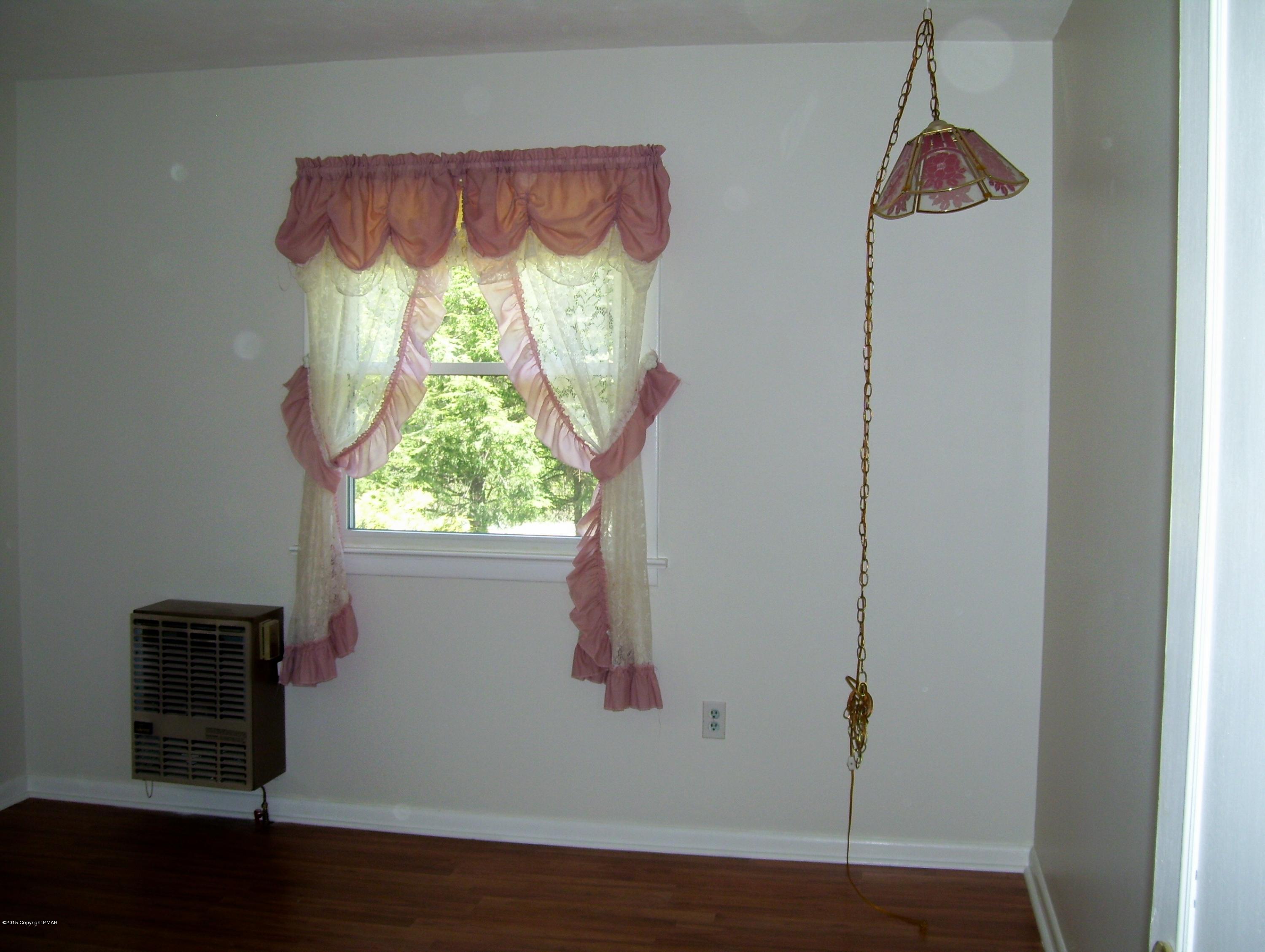 2610 Brookdale Road Scotrun, PA 18355 - Photo 15 of 37 a room with a window and a wooden floor