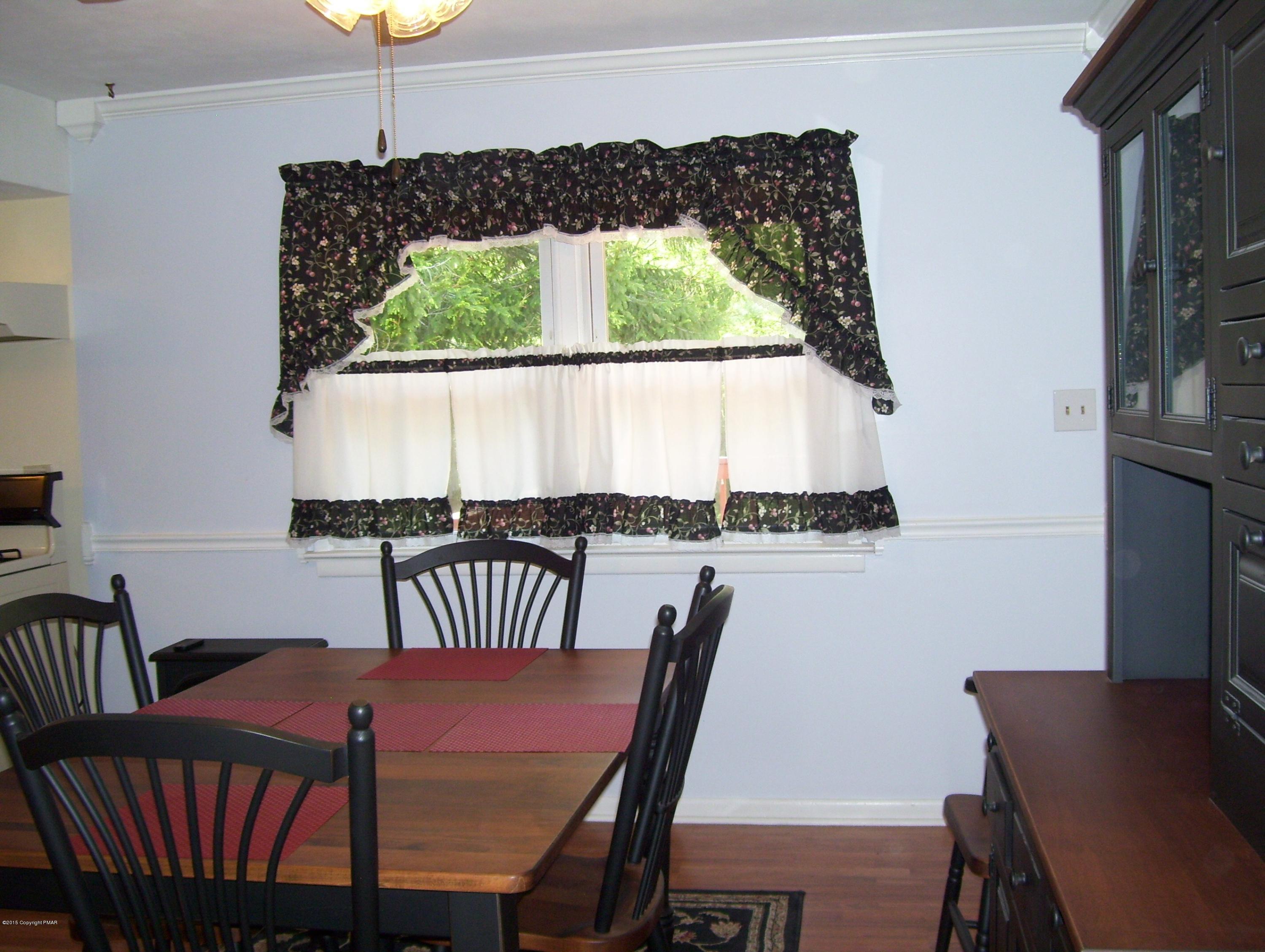 2610 Brookdale Road Scotrun, PA 18355 - Photo 17 of 37 a view of a dining room with furniture window and outside view