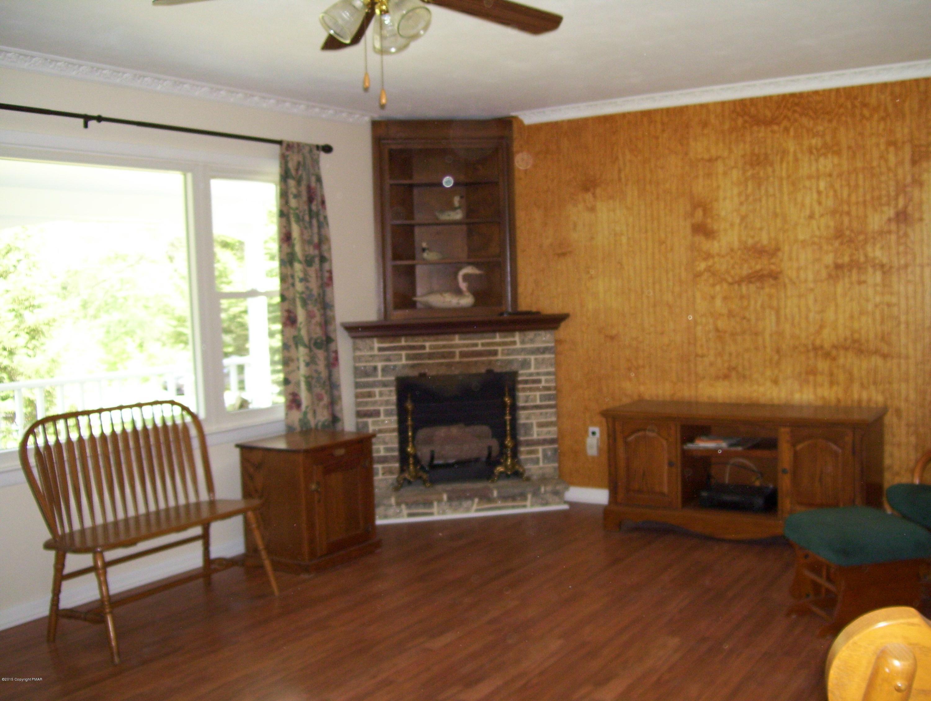 2610 Brookdale Road Scotrun, PA 18355 - Photo 21 of 37 a living room with furniture and a fireplace