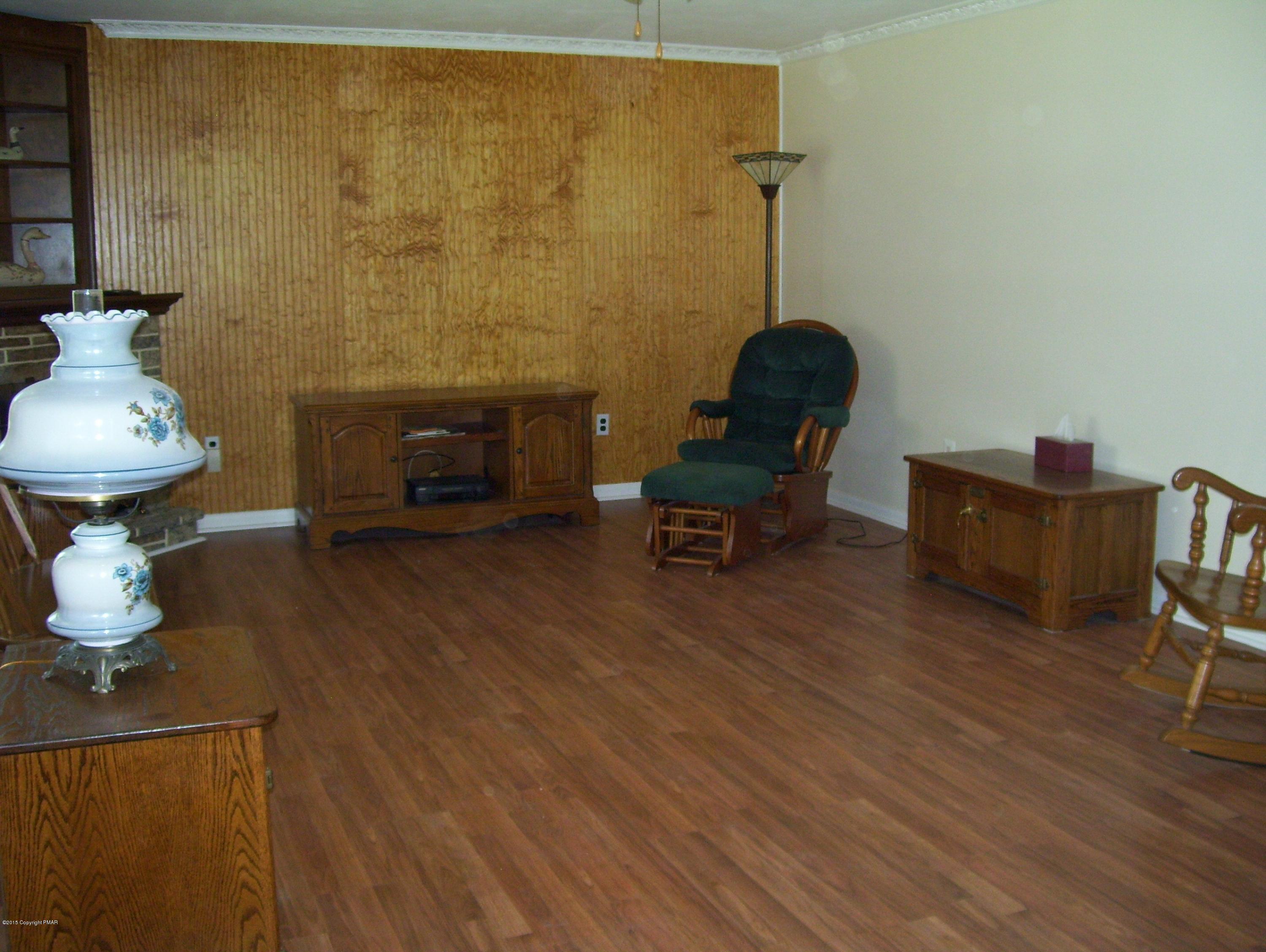2610 Brookdale Road Scotrun, PA 18355 - Photo 22 of 37 a living room with furniture and a fireplace