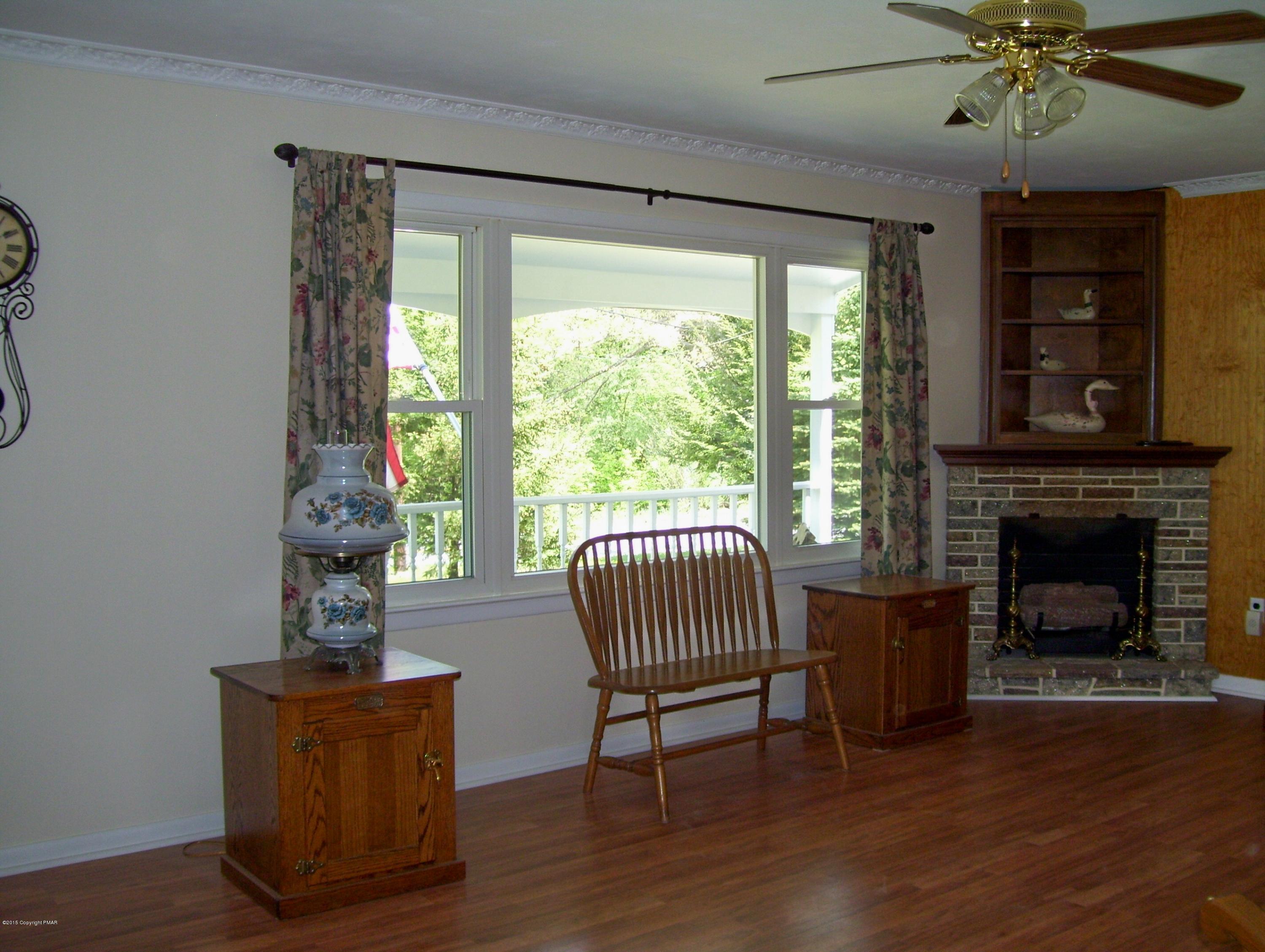 2610 Brookdale Road Scotrun, PA 18355 - Photo 23 of 37 a living room with furniture and a fireplace