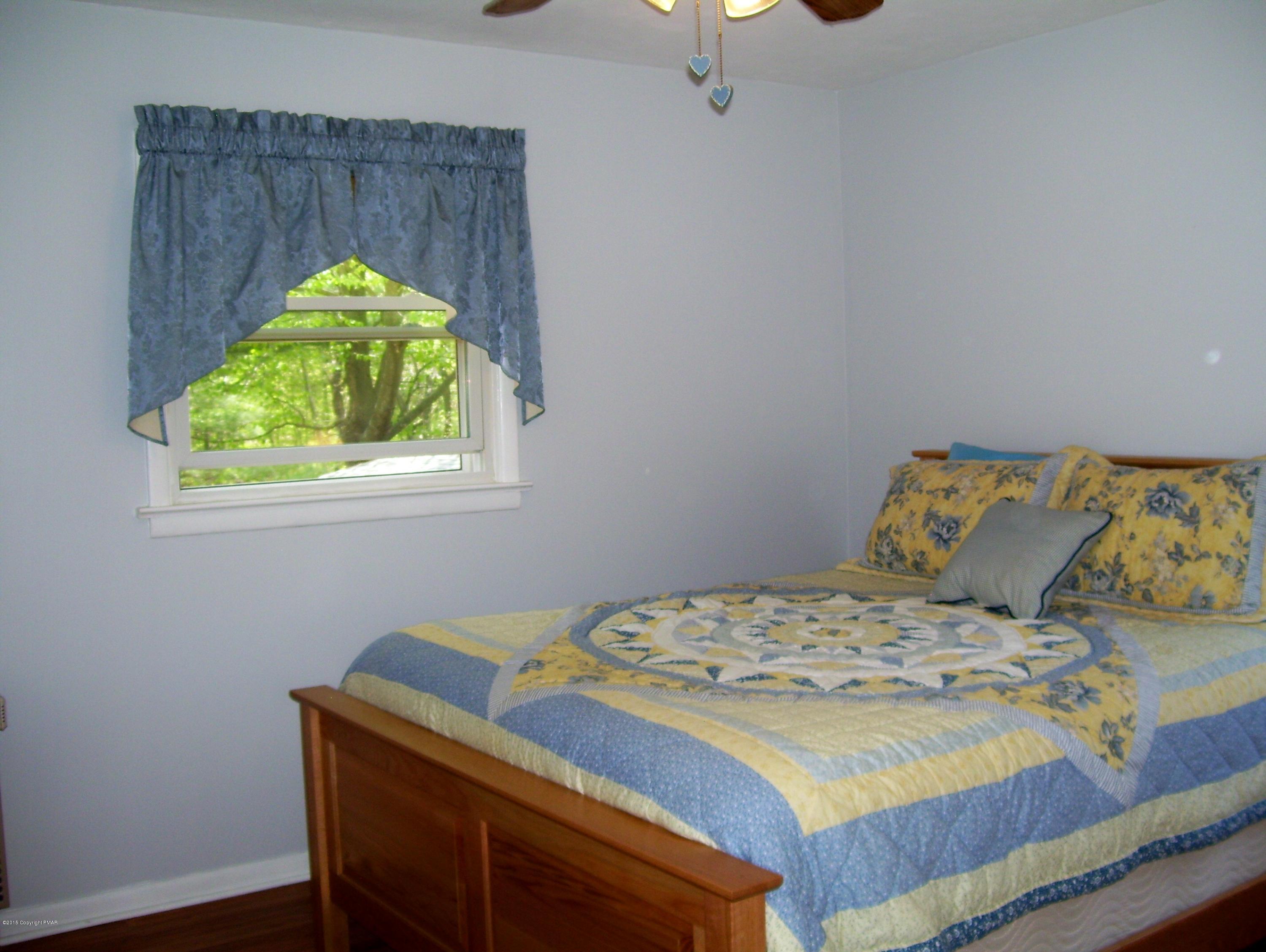 2610 Brookdale Road Scotrun, PA 18355 - Photo 25 of 37 a bedroom with a bed and a window
