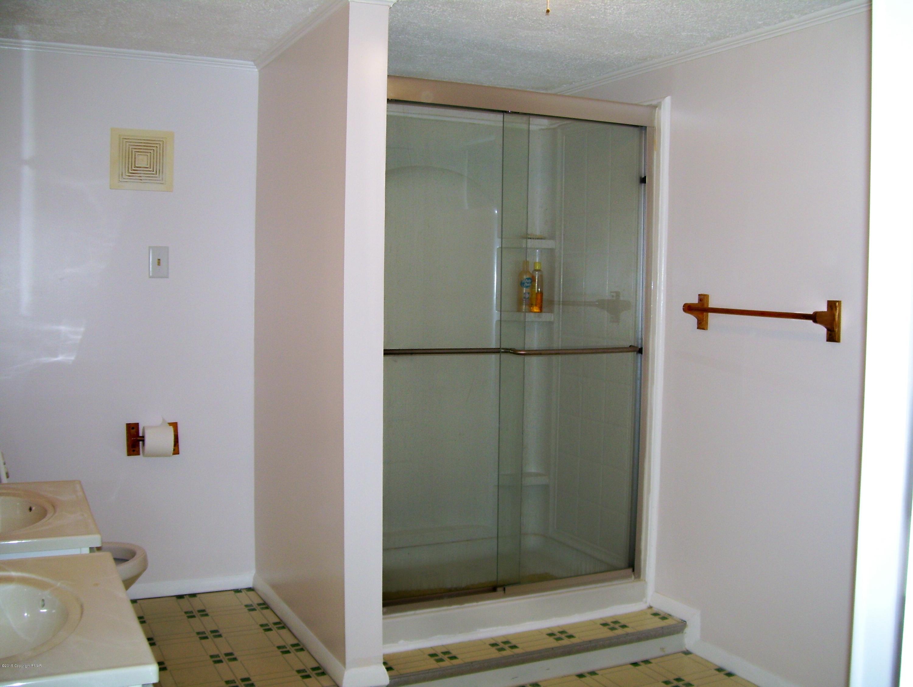 2610 Brookdale Road Scotrun, PA 18355 - Photo 26 of 37 a bathroom with a shower and a toilet