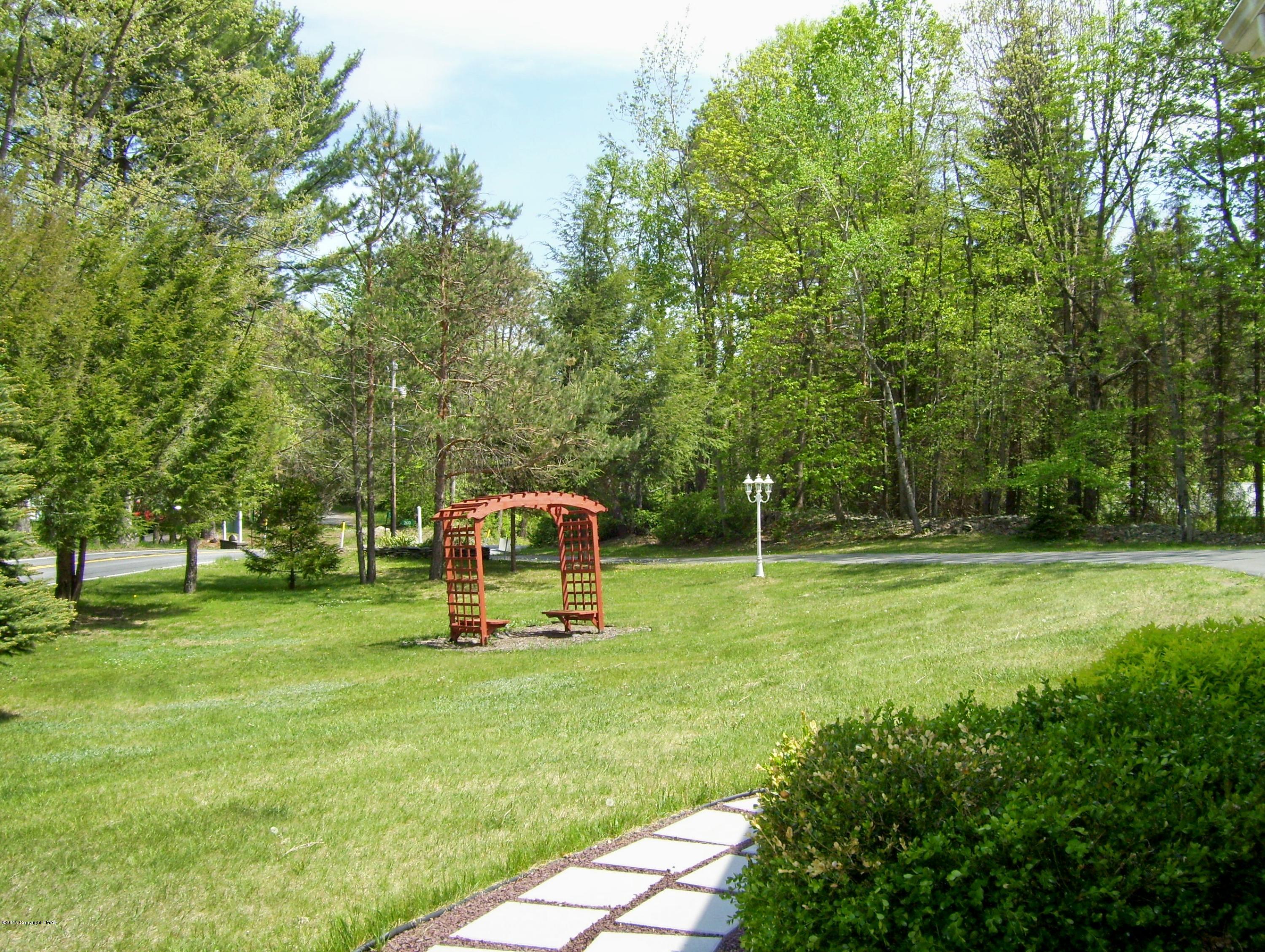 2610 Brookdale Road Scotrun, PA 18355 - Photo 6 of 37 a swimming pool with trees in the background