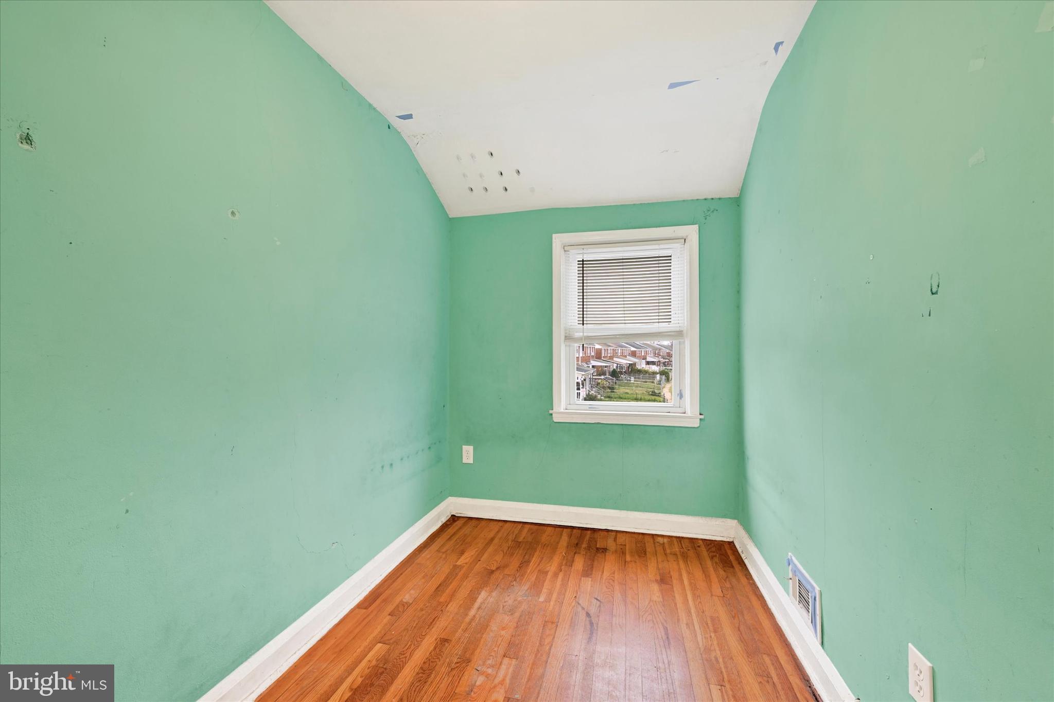 8028 Kavanagh Road Dundalk, MD 21222 - Photo 19 of 29 a view of a room with wooden floor and a window